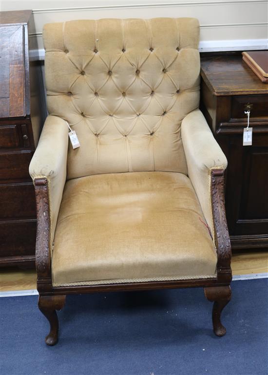 A French walnut button back armchair